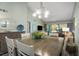 Dining area with table and chairs, view of living room at 431 Cerromar Ln # 446, Venice, FL 34293