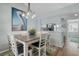 Dining area with table and chairs, open to living room at 431 Cerromar Ln # 446, Venice, FL 34293