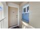 Condo entry with beige door and window at 431 Cerromar Ln # 446, Venice, FL 34293