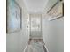 Bright hallway with light walls and wood floor at 431 Cerromar Ln # 446, Venice, FL 34293