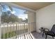 Screened lanai with seating and view of lush landscaping at 431 Cerromar Ln # 446, Venice, FL 34293