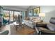 Living room with light sofa and sliding glass doors at 431 Cerromar Ln # 446, Venice, FL 34293