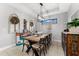 Bright dining room with wood table and eclectic decor at 4611 Alexandria Ct, Palmetto, FL 34221