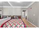 Bright bedroom featuring a large mirror and hardwood floors at 4802 51St W St # 501, Bradenton, FL 34210