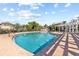 Resort-style pool with brick deck and pergola at 4802 51St W St # 501, Bradenton, FL 34210
