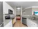 Modern kitchen with granite countertops and stainless steel appliances at 4802 51St W St # 501, Bradenton, FL 34210