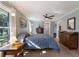 Main bedroom with hardwood floors and large windows at 4928 Hidden Oaks Trl, Sarasota, FL 34232