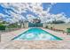 Community pool area with plenty of lounge chairs at 501 Haben Blvd # 303, Palmetto, FL 34221