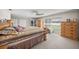 Bright main bedroom with wood furniture and access to the backyard at 5020 Willow Leaf Way, Sarasota, FL 34241