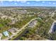 Aerial view of a single Gathering home with a pond nearby at 5213 Asher Ct, Sarasota, FL 34232