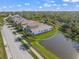 Aerial view of house with backyard access to a pond in a residential neighborhood at 5213 Asher Ct, Sarasota, FL 34232