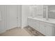 Double vanity bathroom with a large mirror at 5213 Asher Ct, Sarasota, FL 34232