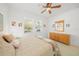 Bedroom with a queen-size bed and wood dresser at 5213 Asher Ct, Sarasota, FL 34232