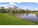 Peaceful canal view with lush green landscaping and trees at 5213 Asher Ct, Sarasota, FL 34232