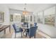 Sunlit dining area featuring a round table and four chairs at 5213 Asher Ct, Sarasota, FL 34232