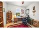 Bright home office with wood desk, comfortable chair, and bookshelves at 5213 Asher Ct, Sarasota, FL 34232