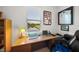 Home office boasts a view, desk with laptop and a comfortable chair at 5213 Asher Ct, Sarasota, FL 34232