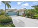 House exterior with a two car garage and manicured landscaping at 5213 Asher Ct, Sarasota, FL 34232