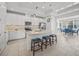 Modern kitchen featuring white cabinets, island, and breakfast nook at 5213 Asher Ct, Sarasota, FL 34232