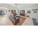 Spacious living room with comfortable seating and a large TV at 5213 Asher Ct, Sarasota, FL 34232