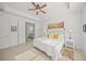 Bright main bedroom with a king-size bed and en-suite bathroom at 5213 Asher Ct, Sarasota, FL 34232