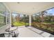 Enjoy the view from this screened porch with outdoor seating at 5213 Asher Ct, Sarasota, FL 34232