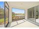 Relaxing screened porch overlooking a pond and lush landscape at 5213 Asher Ct, Sarasota, FL 34232