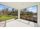 Relaxing screened porch overlooking a tranquil backyard and water feature at 5213 Asher Ct, Sarasota, FL 34232