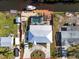 Aerial view of a single Gathering home with a pool and canal access at 524 Palm Ave, Ellenton, FL 34222