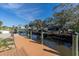 Long wooden dock extending over the canal at 524 Palm Ave, Ellenton, FL 34222