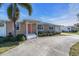 Front view of single story home with coral colored door at 524 Palm Ave, Ellenton, FL 34222