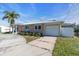 Side view of single story home with garage and fenced yard at 524 Palm Ave, Ellenton, FL 34222