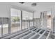 Under construction living room, exposed framing and flooring, view to other rooms at 524 Palm Ave, Ellenton, FL 34222