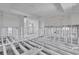 Renovation project: gutted living room with tile floor, exposed framing, and pool view at 524 Palm Ave, Ellenton, FL 34222