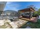 Inviting pool area with pergola, deck, and picnic table at 524 Palm Ave, Ellenton, FL 34222