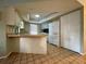 This kitchen features white appliances and lots of cabinet space at 5320 Fox Run Rd, Sarasota, FL 34231