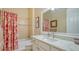 Clean bathroom with a shower/tub combo and white vanity at 5632 Fossano Dr, Sarasota, FL 34238