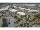 Aerial view of shopping center and surrounding area at 5697 Sheffield Greene Cir # 51, Sarasota, FL 34235