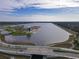 Aerial view of park with lake and recreational facilities at 5697 Sheffield Greene Cir # 51, Sarasota, FL 34235