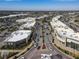 Aerial of shopping center with stores and parking at 5697 Sheffield Greene Cir # 51, Sarasota, FL 34235