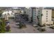 Aerial view of shopping center with ample parking at 5697 Sheffield Greene Cir # 51, Sarasota, FL 34235
