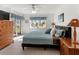 Spacious bedroom with king-size bed and access to a private patio at 5697 Sheffield Greene Cir # 51, Sarasota, FL 34235
