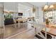 Dining room features a table with four chairs and mirrored wall reflecting kitchen at 5697 Sheffield Greene Cir # 51, Sarasota, FL 34235