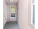 Inviting condo entryway with white door and neutral walls at 5697 Sheffield Greene Cir # 51, Sarasota, FL 34235