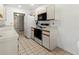 Bright kitchen featuring white appliances and ample counter space at 5697 Sheffield Greene Cir # 51, Sarasota, FL 34235