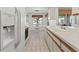 Kitchen with white cabinets and appliances at 5697 Sheffield Greene Cir # 51, Sarasota, FL 34235