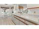 Kitchen with white cabinets and double sink at 5697 Sheffield Greene Cir # 51, Sarasota, FL 34235