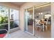 View from patio shows sliding doors leading to dining area at 5697 Sheffield Greene Cir # 51, Sarasota, FL 34235