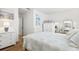 Spacious bedroom with a queen bed and white dresser at 5974 Hibiscus Dr # 06, Bradenton, FL 34207