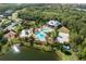 Community pool, playground, and sports courts are featured in this aerial view at 6010 Anise Dr, Sarasota, FL 34238